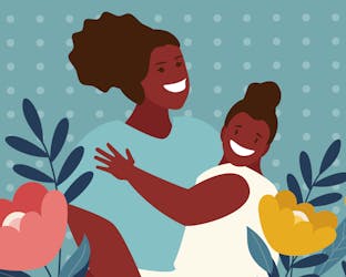 Mother holding a child smiling